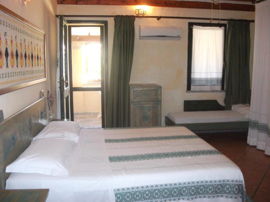 Hotel Fiore Di Maggio Villasimius Habitación foto